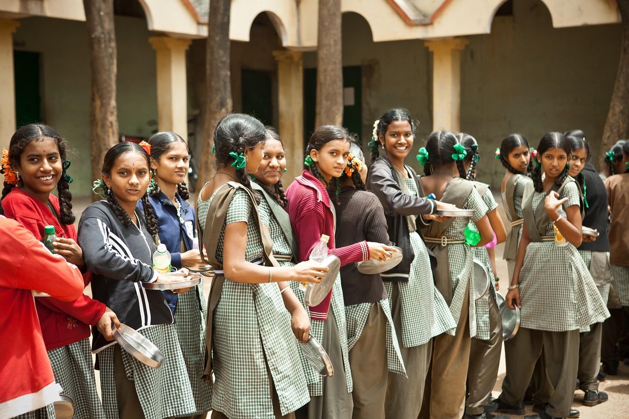 A group of young women students standing together