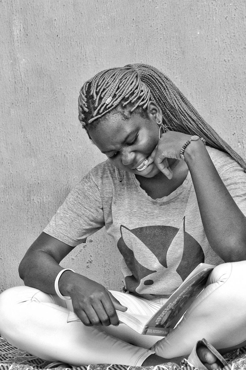 A young woman studying with a notebook